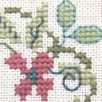 detail of cross stitch family tree sampler