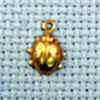 ladybird brass charm
