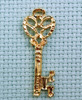 large key brass charm