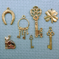 set of lucky brass charms