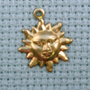 small sun brass charm